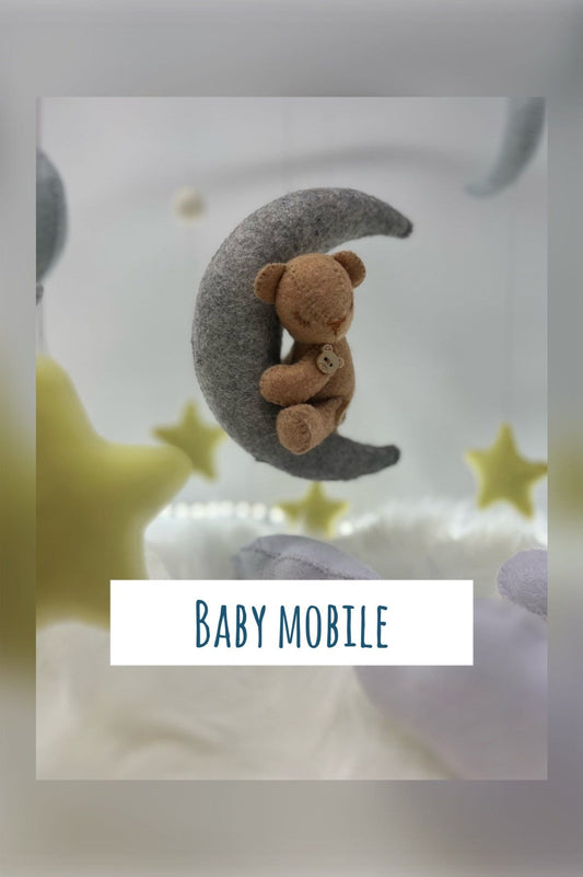 Personalised floating baby mobile in felt with adorable handmade stars, clouds and a tiny teddy bear